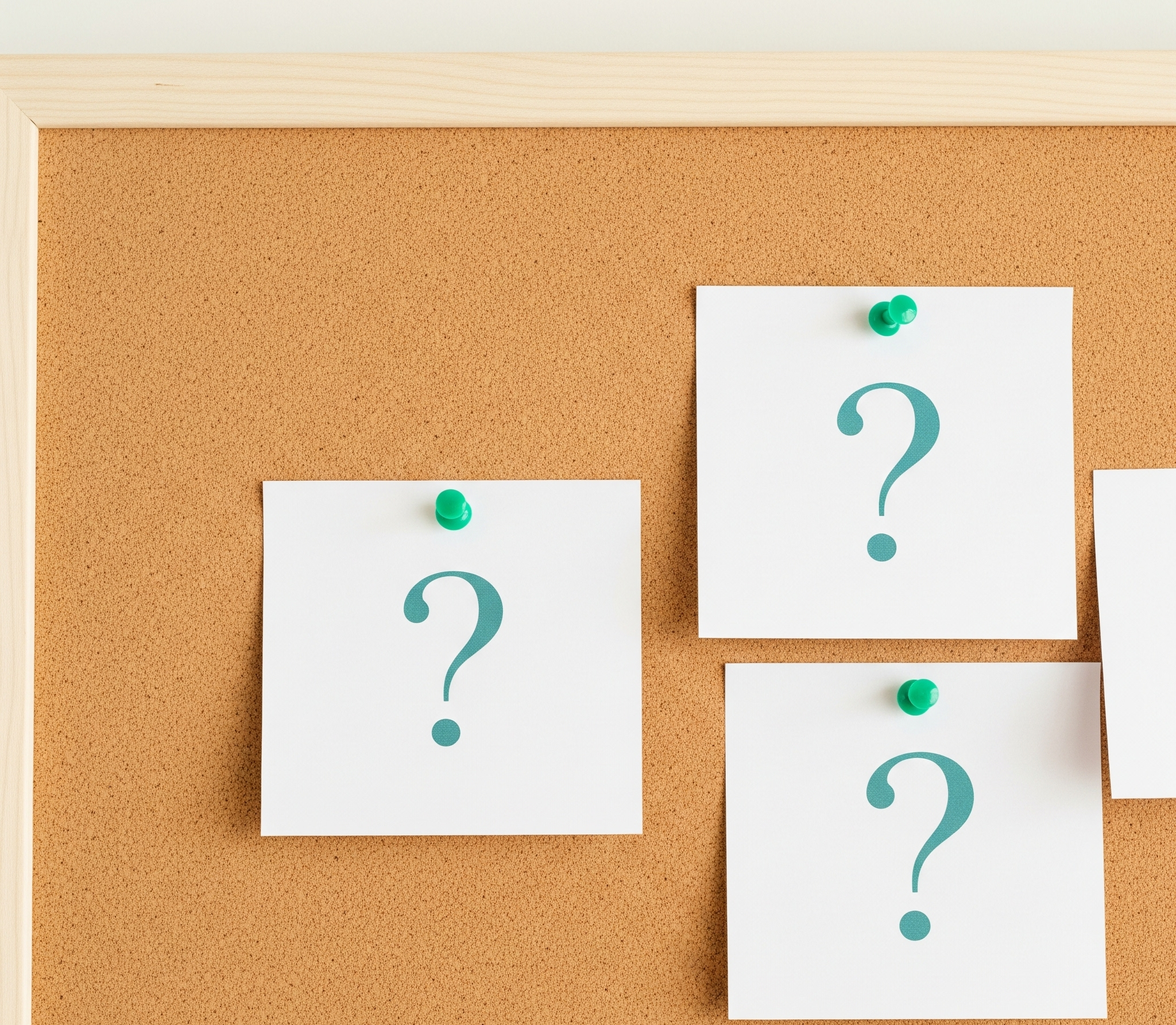 A Minimalist And Clean Shot Of A Light Colored Corkboard. Pinned To The Board With Simple Thumbtacks Are A Few Neat, White Note Cards.